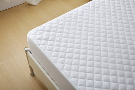 Included in the bundle: waterproof quilted Twin XL mattress pad fitted to a residence mattress