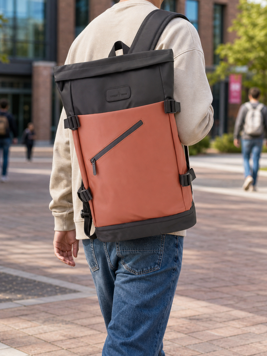 Tan roll-top laptop backpack worn over one shoulder on campus