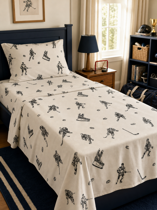 Hockey print flannel Twin sheet set made up on a child's bed