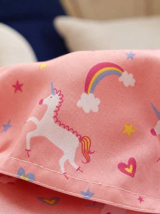 Fabric detail of the pink unicorn print cotton blend