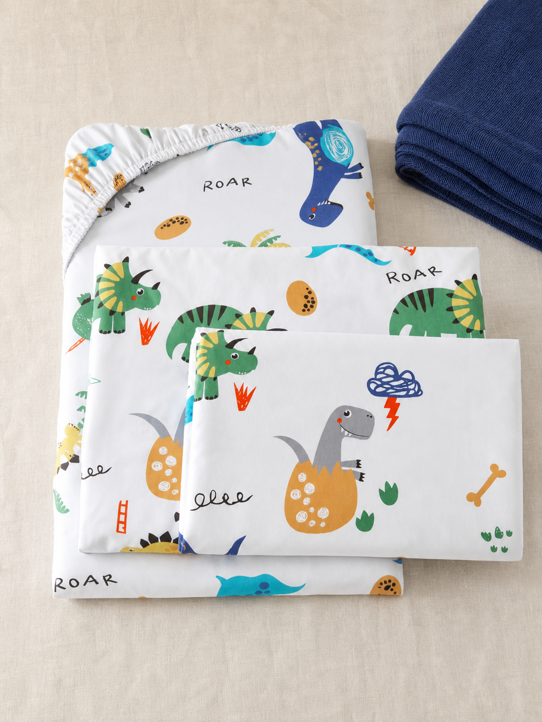 Flat lay of the dinosaur print Twin sheet set