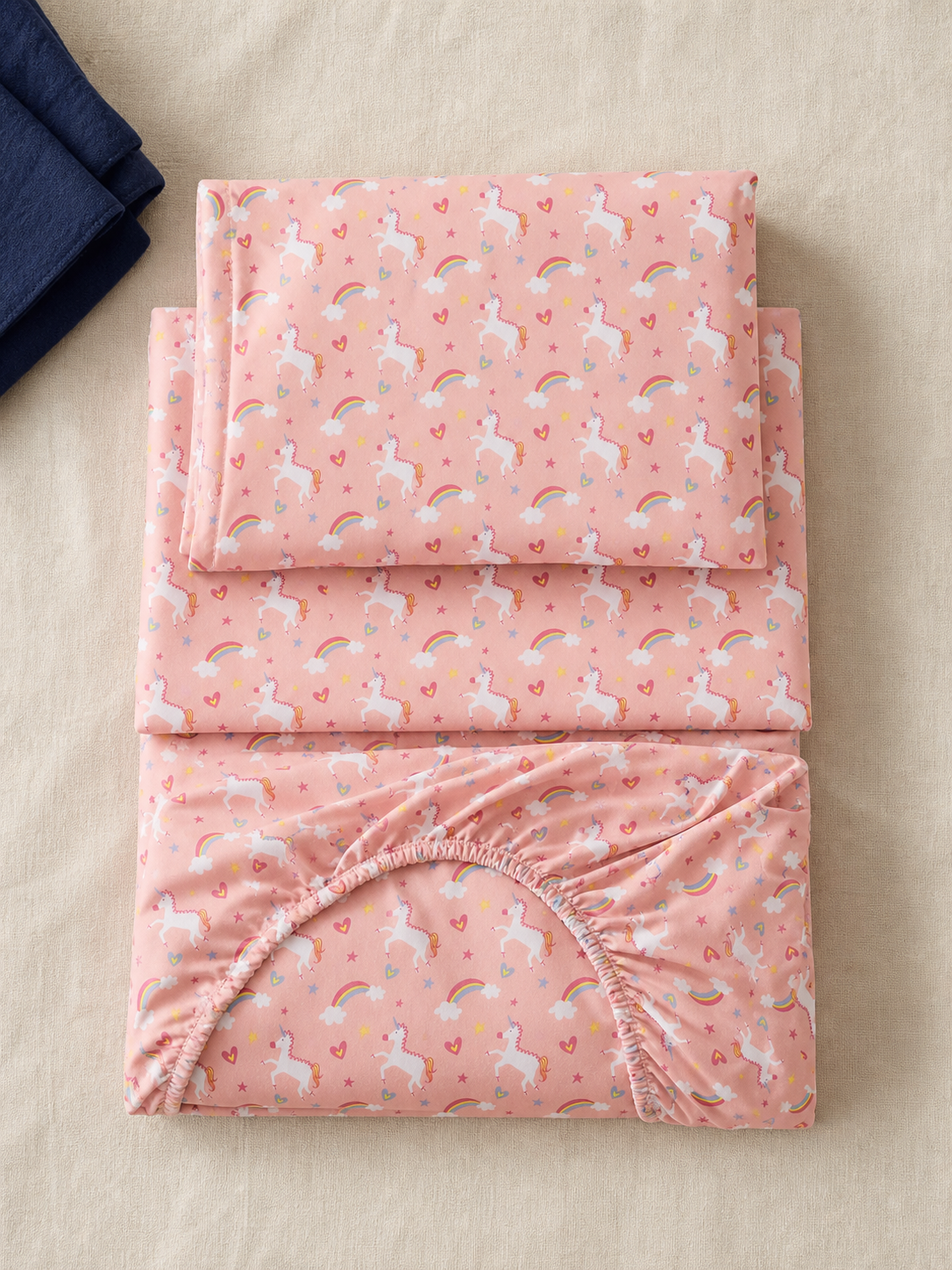 Flat lay of the pink unicorn Twin sheet set