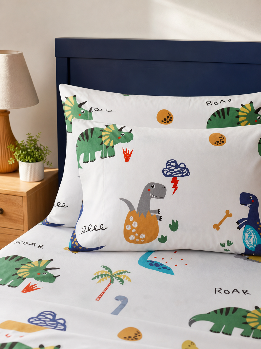 Pillowcase detail from the dinosaur print kids sheet set