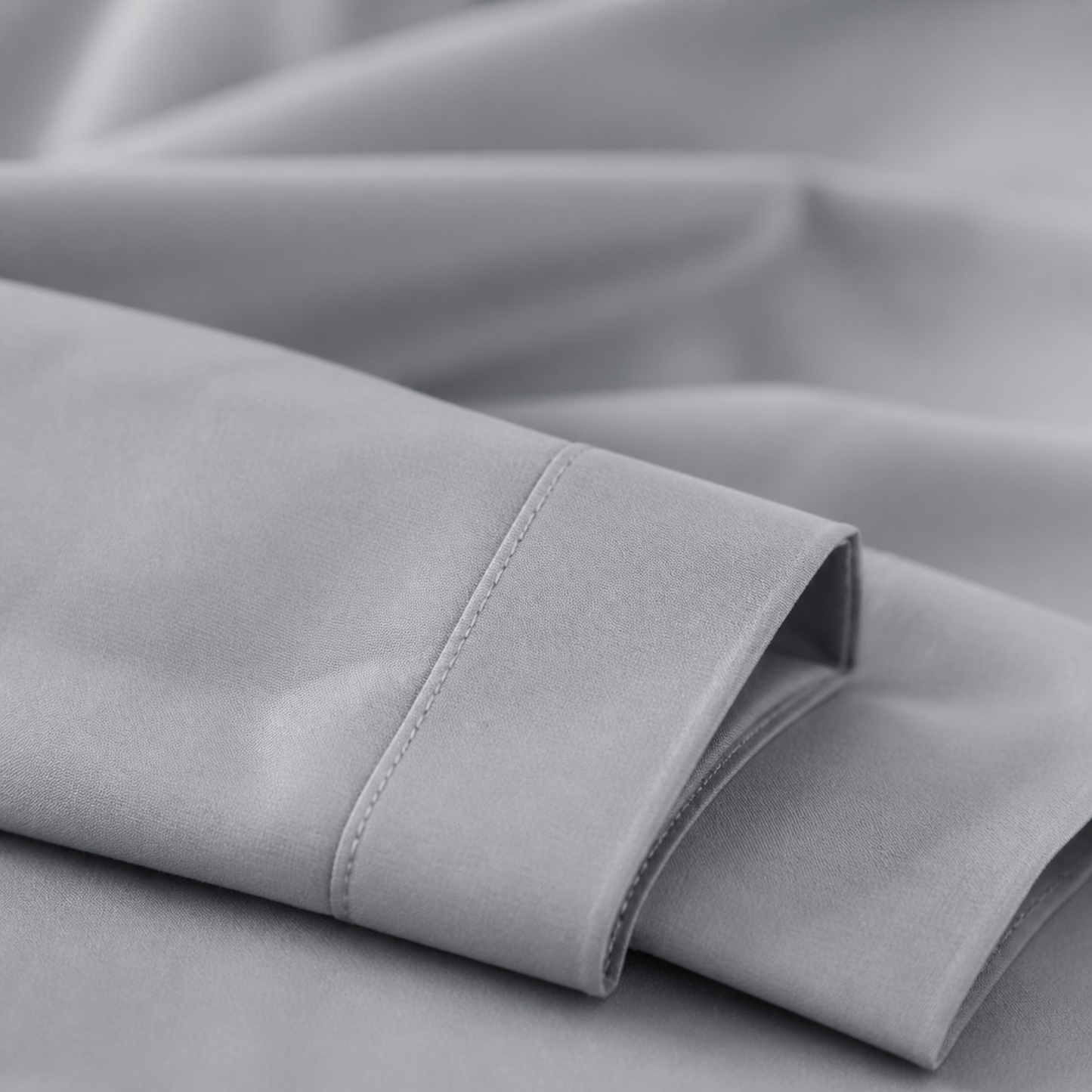 Close-up of the silver 600 thread count percale weave and stitched hem
