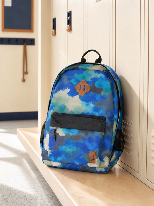 Blue and grey camouflage kids backpack hanging on a school locker