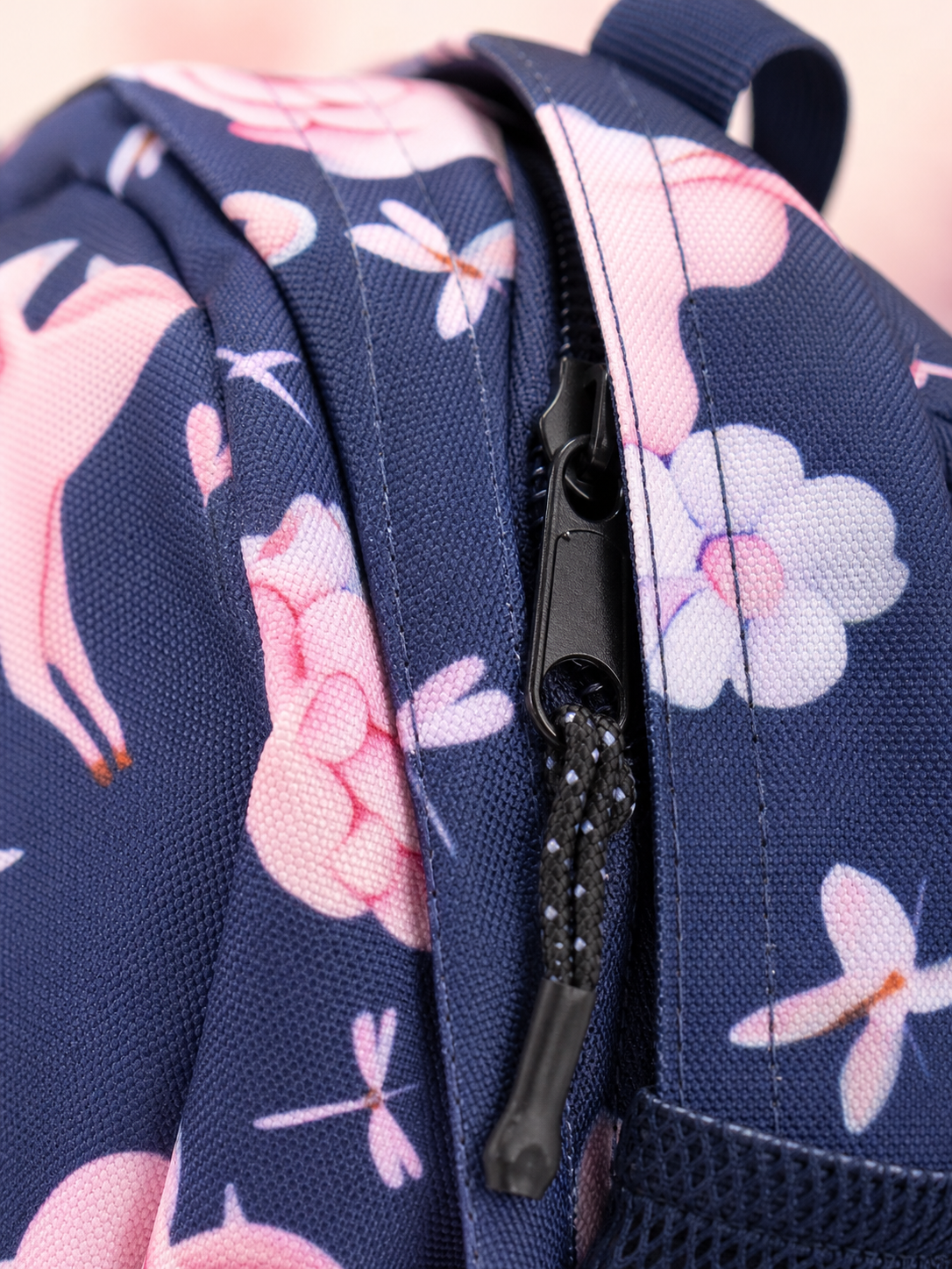 Macro texture detail of the navy unicorn backpack fabric
