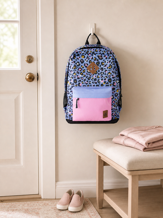Leopard print kids backpack on an entryway hook