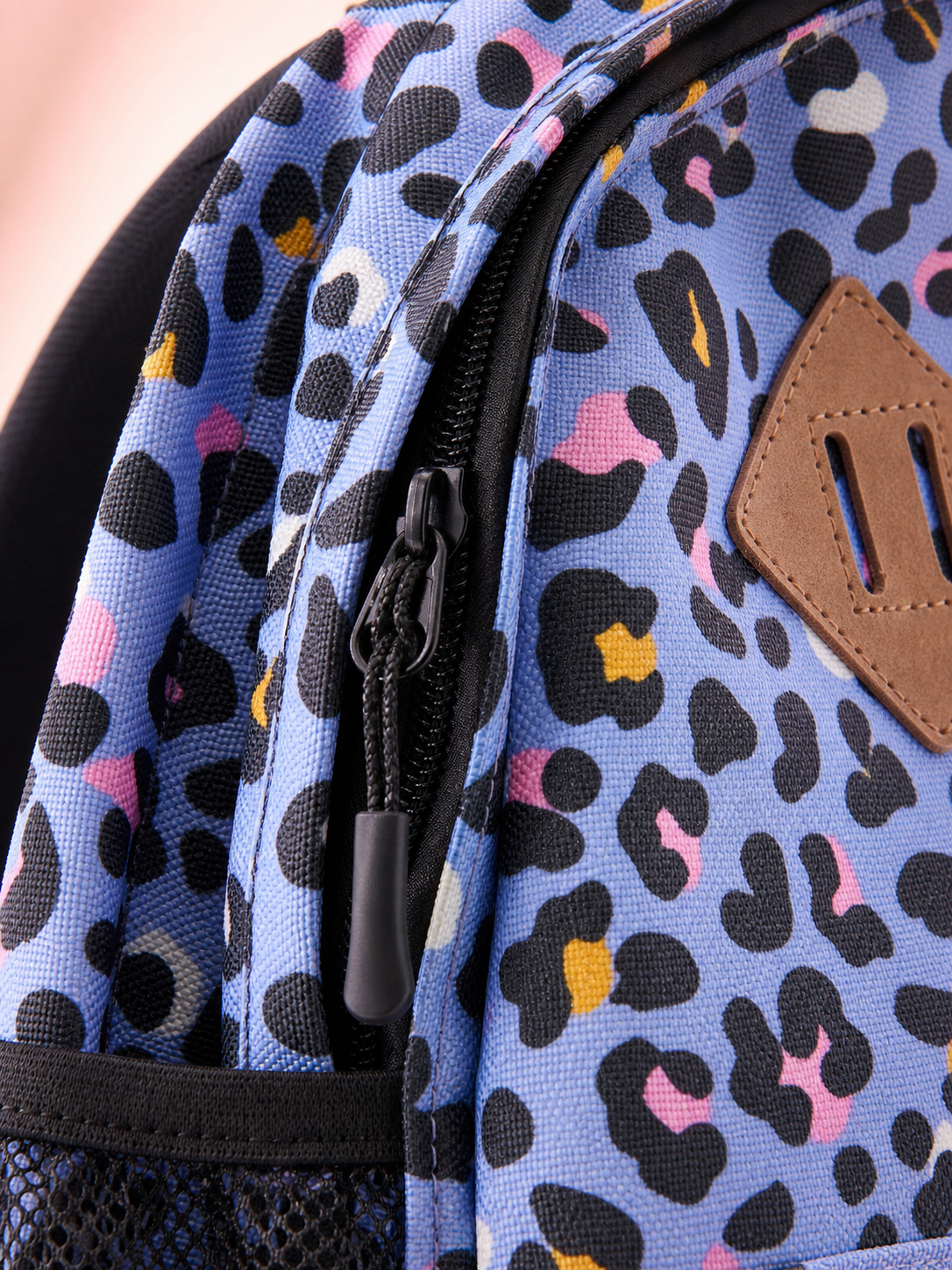 Macro texture detail of the leopard print backpack fabric