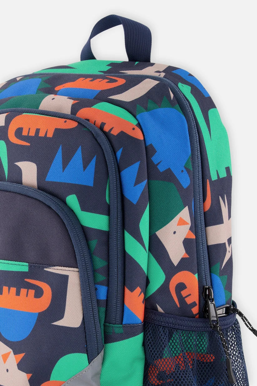 Side profile of the navy dinosaur print preschool backpack