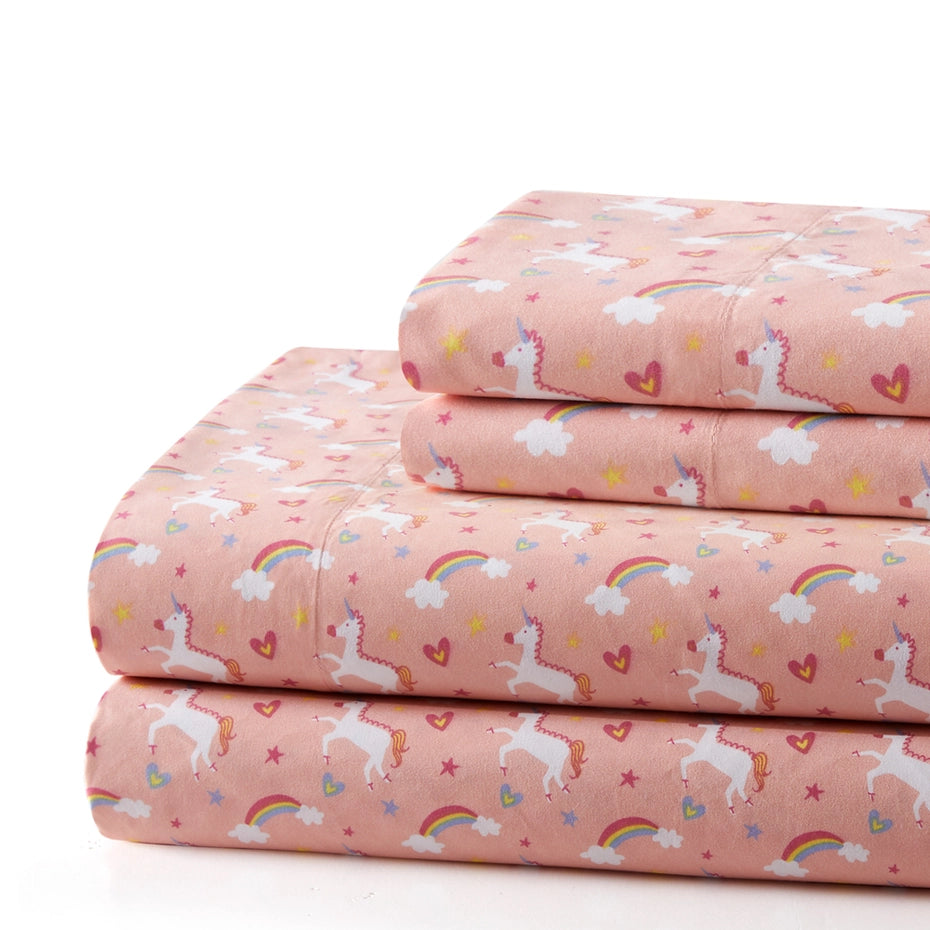 Pink unicorn bedding styled in a child's bedroom