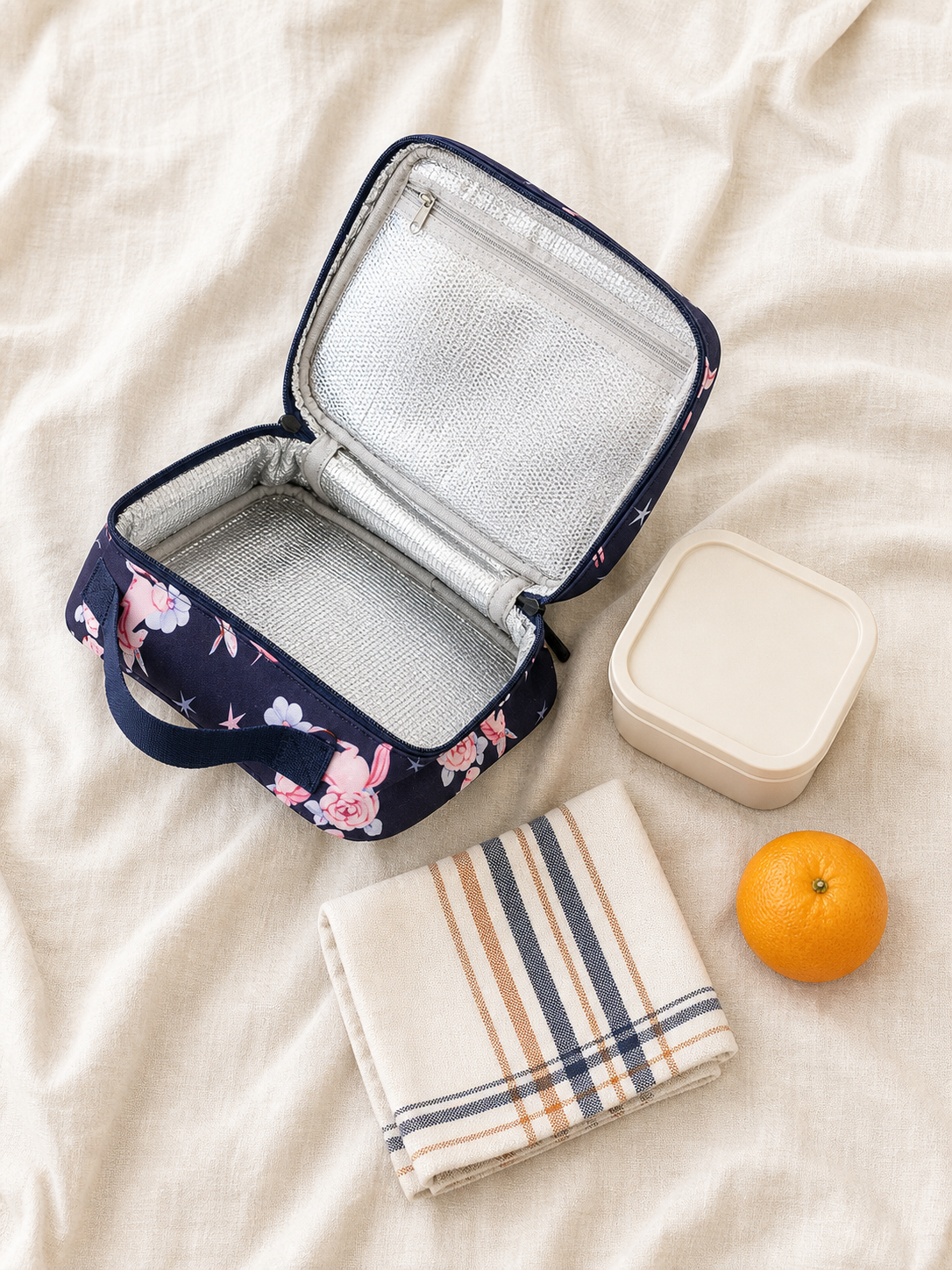 Flat lay of the navy unicorn snack box with lunch items