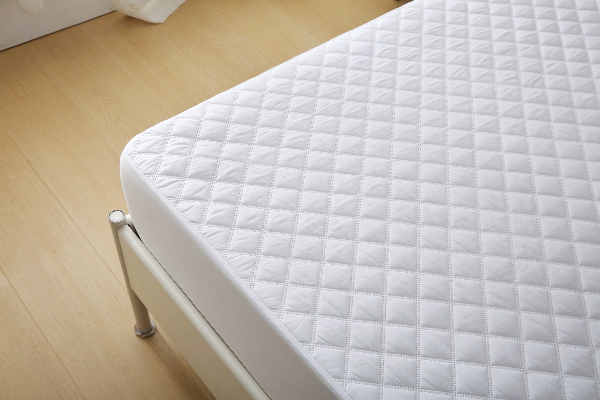 Included in the bundle: waterproof quilted Twin XL mattress pad fitted to a dorm mattress
