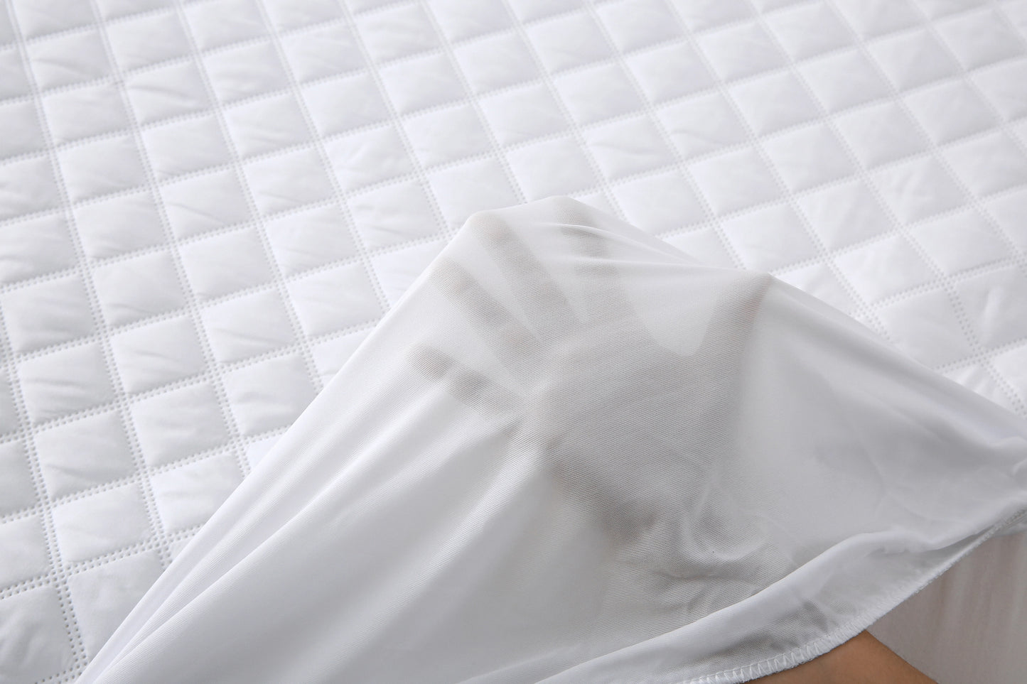 Close-up of the quilted surface and stitching on the Twin XL mattress pad