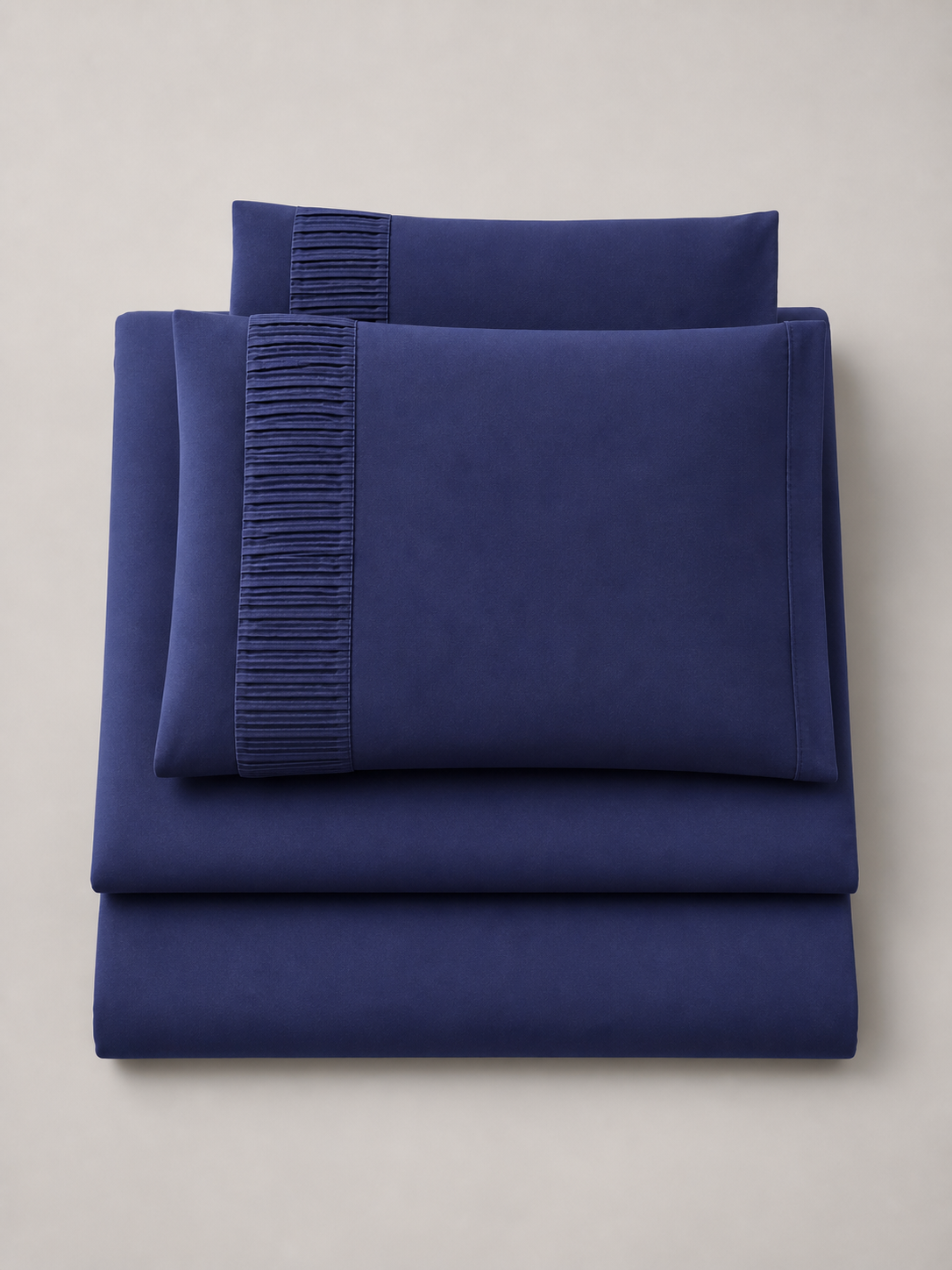 Flat lay of the navy blue 4-piece Twin XL sheet set